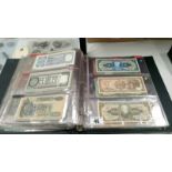 A folder of approximately 120 World bank notes,