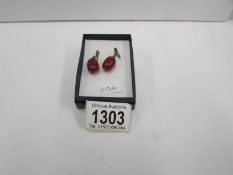 A pair of amber ear pendants for pierced ears in silver