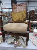 A cane backed elbow chair