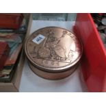 A 'penny' tin with various tokens and medallions