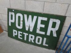 A large enamel 'Power Petrol' sign