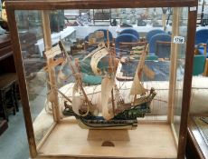 A good old model galleon in full sail and in case