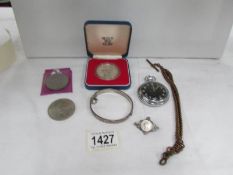 A mixed lot including coin brooch, pocket watch,