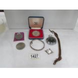 A mixed lot including coin brooch, pocket watch,