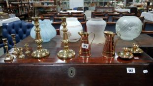4 pairs of brass candlesticks and a pair of brass and copper jugs