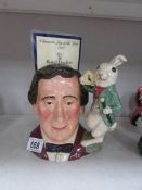 A Royal Doulton character jug of Lewis Carroll with rabbit handle