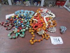 A collection of 1930's stone/mineral necklaces including Salmon coral