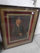 A gilt framed portrait of a gentleman in a mahogany case