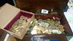 A box of machine and Victorian gambling tokens