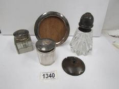 A silver photo frame, a silver topped sugar sifter,