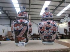 A pair of Chinese lidded jars