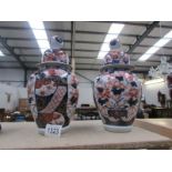 A pair of Chinese lidded jars