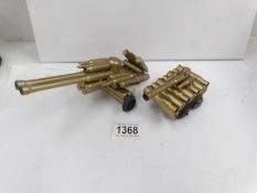 A model of a tank and a model of an artillery gun made from shell cases
