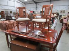 A modern extending dining table and 6 chairs