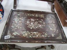 An 18th/19th century Chinese hard wood tray with mother of pearl inlaid butterfly and floral