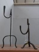 A pair of wrought iron rush lights,