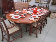 A large extending dining table with 2 leaves and 8 chairs