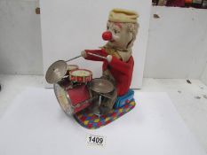 An 'ALPS' made in Japan battery tin plate drummer clown