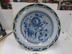 A large 19th century blue and white charger a/f (chips to rim)