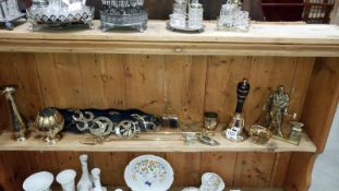 A quantity of brass ware including horse brasses, bells & figure of a blacksmith etc.