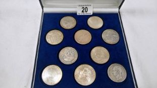 A case of 10 world silver coins (crown size)