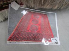 A red patterned rug