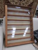 An 8 shelf wall display cabinet