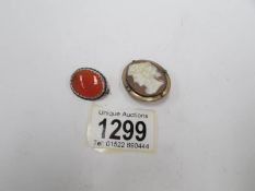 A Victorian shell cameo profile of a young woman and a cornelian set oval brooch