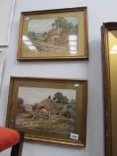 A pair of framed and glazed watercolours of thatched cottages