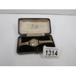 A gold cased vintage ladies wrist watch