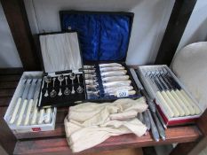 A large quantity of cutlery including cased sets