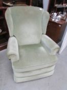 A recliner wing arm chair