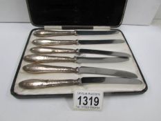 A cased set of vintage silver handled knives