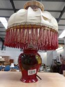A Moorcroft clematis table lamp with flambe' glaze