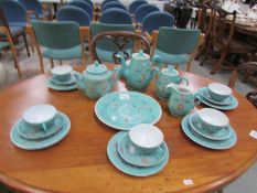 A turquoise oriental tea and coffee set