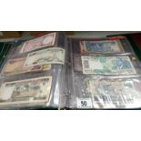 A folder of approximately 86 world bank notes,