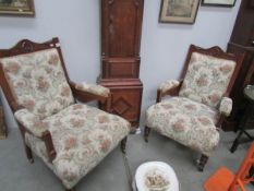 A pair of Edwardian arm chairs