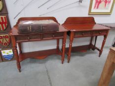 A pair of mahogany hall tables with 2 drawers