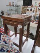 A 20th century Chinese hardwood stool with mother of pearl inlay