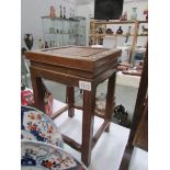 A 20th century Chinese hardwood stool with mother of pearl inlay