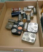 A quantity of coin holders and money savers