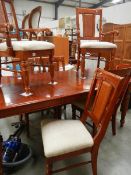 An extending dining table and 6 chairs