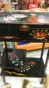 A lacquered jewellery table/cabinet