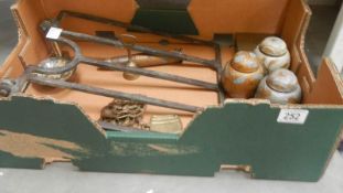 A box of miscellaneous metal ware including Victorian range trivet