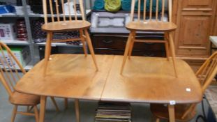 An Ercol dining table and 4 chairs