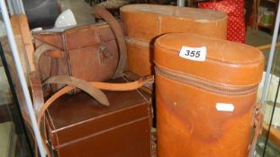 A quantity of old leather cases