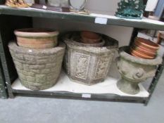 A mixed lot of garden pots and urns