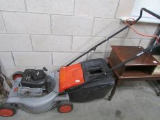 A Flymo petrol mower