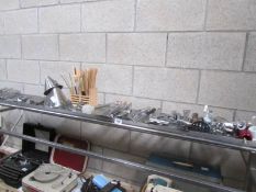 A stainless steel stand and kitchen utensils