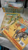 A quantity of old Rupert Bear books and 2 Rupert jigsaw puzzles